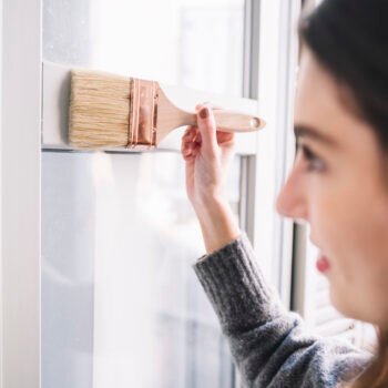 pretty woman painting window